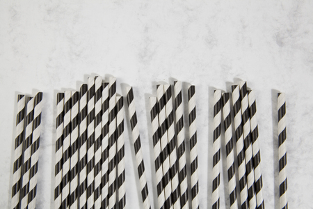 numerous straw on marble and turquoise color backgroundの写真素材