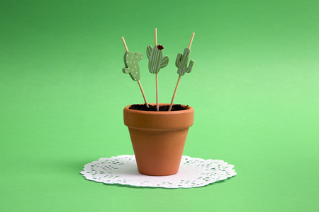 Cactus toothpick planted in a pot like a real. Green on green. Minimal color still life photographyの写真素材