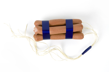 sticks of dynamite are replaced by industrial sausages. Photographic composition funny and offbeat...