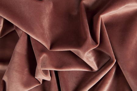 close-up view of an old pink velvet curtain. Minimal color still life photographyの写真素材