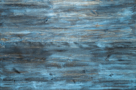 Blue stained wood texture background with a worn distressed effect. Use this weathered wooden textured material as design asset for a wall, floor boards, wallpaper, table surface or abstract backdrop.の写真素材
