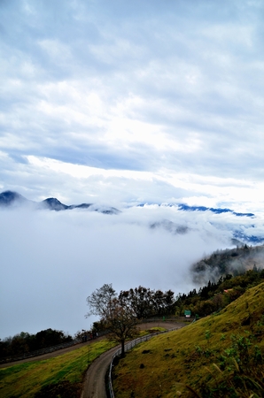 Cliff road by the mountainsの写真素材