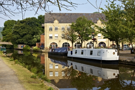 Canal and house boats on the canal at Hebden Bridge in Yorkshireのeditorial素材