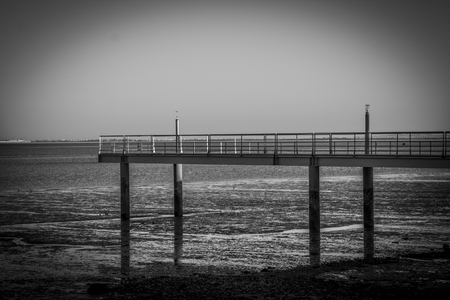 The bridge over the sea. photo taken in black and whiteの写真素材