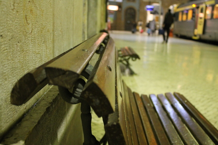 the wooden bench inside a train station where it awaitsの写真素材