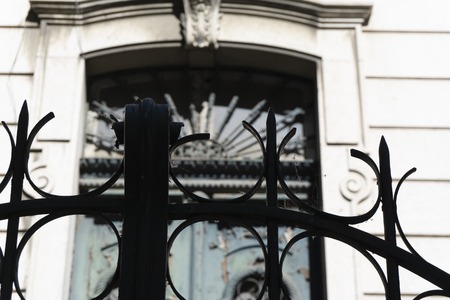 looks from the outside behind iron gate ancient and carved in Gothic styleの写真素材