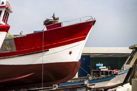 small fishing boats moored in port of many colors