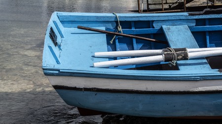 small fishing boats moored in port of many colorsの写真素材