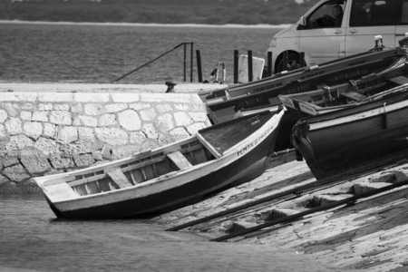 small fishing boats moored in port of many colorsの写真素材