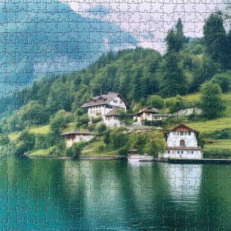 Jigsaw puzzle in the shape of a house on the shore of a lakeの素材