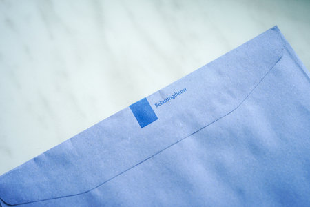 The Hague, The Netherlands - June 11, 2022: Official blue envelopes of the Dutch Tax Authorities (Dutch: Belastingdienst)のeditorial素材