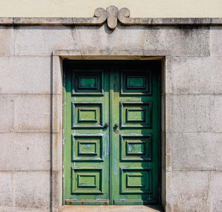 Green wooden door in an old cityの写真素材