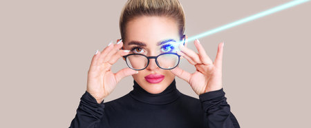 Beautiful woman takes off glasses after laser surgery and correction on beauty female eye.の写真素材