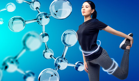 Sporty girl posing among glassy molecules. good metabolism concept. Over blue background.の写真素材