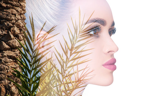 Double exposure portrait of young woman and palm trees. vacation concept. Over white background.の写真素材