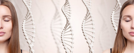 DNA stems and beautiful young woman over gray background. Science of beauty concept.の写真素材