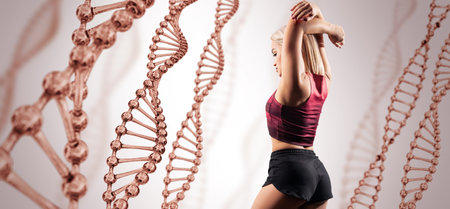 Sporty girl posing among DNA stems. good metabolism concept. Beige background.の写真素材