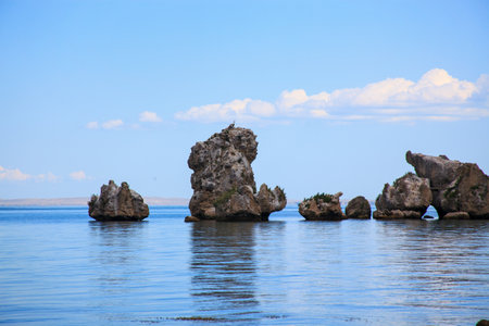 Big powerful rocks in the middle of the blue sea. Beautiful landscape of black sea.の写真素材