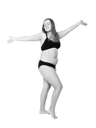 Confident smiling woman with overweight natural body posing. Body positivity concept.の写真素材