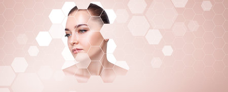 Sensual woman face shows up from mosaic honeycombsの写真素材