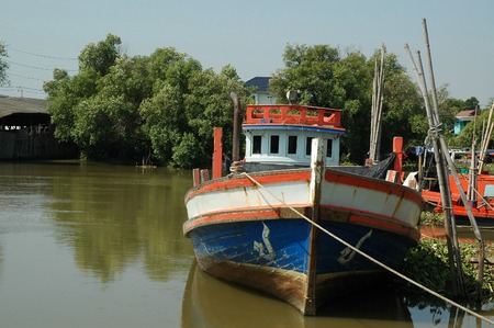 Fishing Boat Lays alongside the Dockageの写真素材