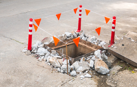 Maintenance of sewer drainage repair site on the road.の写真素材