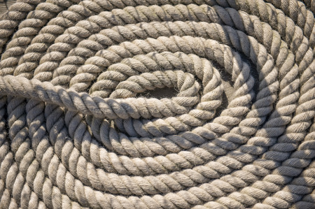 Shipping rope on a ship deck laid in a circleの写真素材