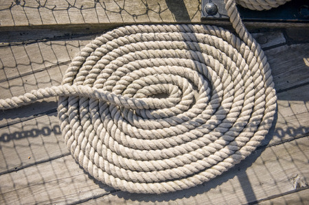 Shipping rope on a ship deck laid in a circleの写真素材