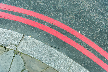 Parking red lines near road near pavementの写真素材