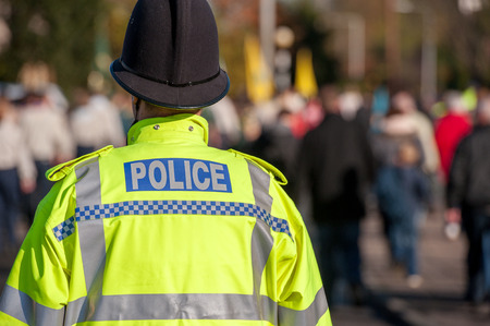 British police officer uniform with high visable yellow jacket