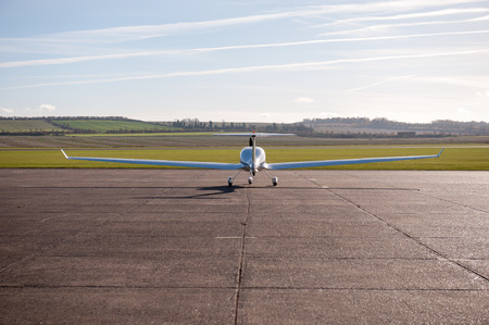 Back of Aircraft on air field in late evening