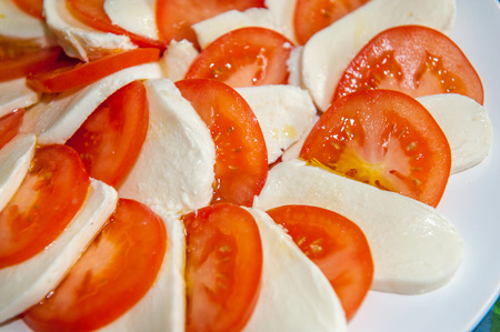 Close up of mozzarella cheese and large tomatoesの写真素材