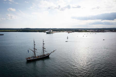 Large sail ship on seawater near land