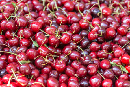 Red cherries in the market. Close-up. Cherry background.