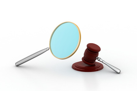 judge gavel and soundboard watching through the magnifierの写真素材