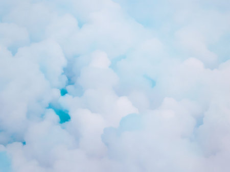 Blue sky background with tiny clouds. Abstract nature background with copy spaceの素材