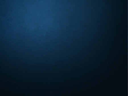 Dark blue background with black vignette and grunge texture.の素材