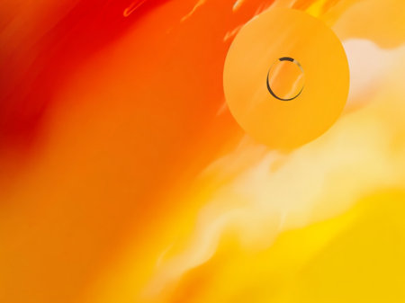 A close up shot of a ball on a orange and yellow backgroundの素材