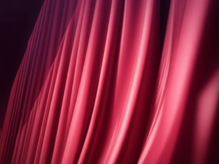 Red satin drapery fabric background. Closeup of beautiful folds of satin cloth.の素材