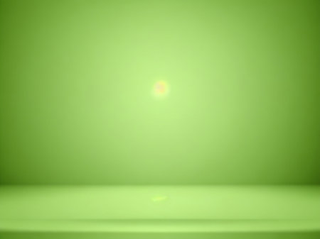 Green gradient abstract background with spotlight. Empty room for product display.の素材