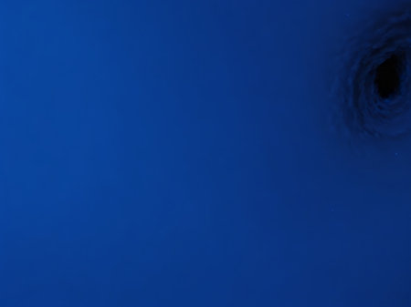 abstract dark blue background with a hole in the middle of itの素材
