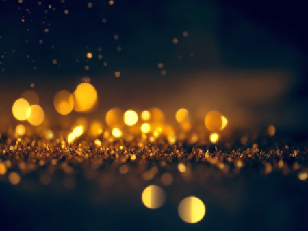 Golden bokeh lights on black background. Christmas and New Year concept.の素材