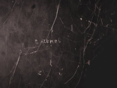 Black marble texture background with grunge brush strokes and light spots.の素材