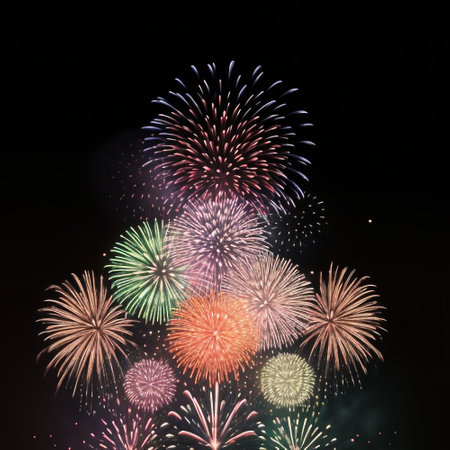 Colorful fireworks of various colors over night sky, celebration and anniversary conceptの素材