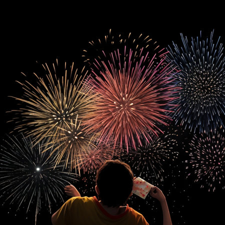 Young boy looking at fireworks on black background with space for text.の素材