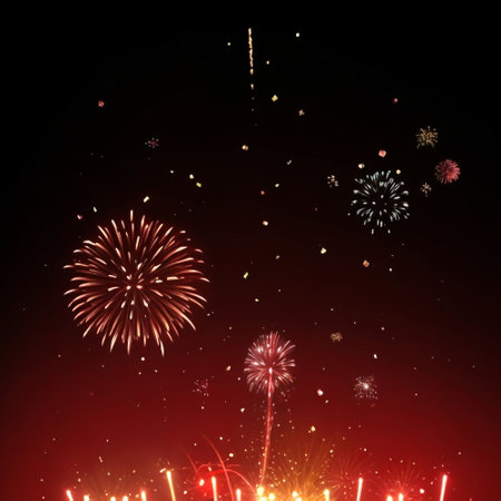 Fireworks of various colors and shapes on a dark background with copy spaceの素材