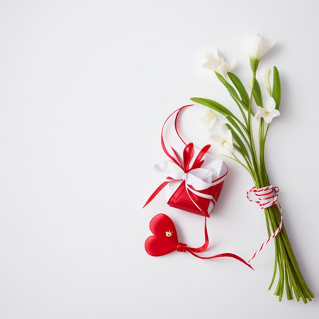 Bouquet of white tulips and red heart on white backgroundの素材