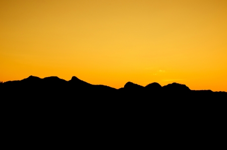 Beautiful sunset sky over the mountains の写真素材
