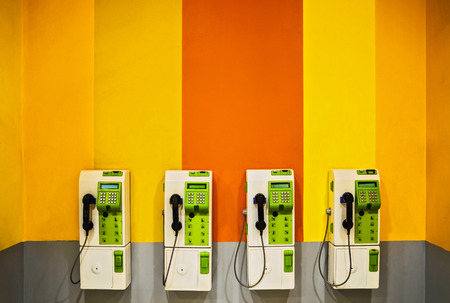 payphone on wall background pblicの写真素材