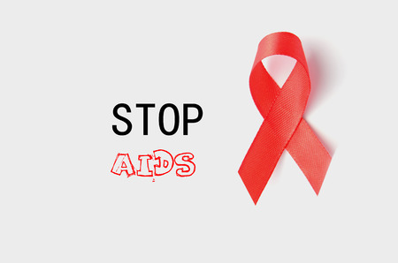 Aids Awareness Red Ribbon. World Aids Day on white backgroundの写真素材